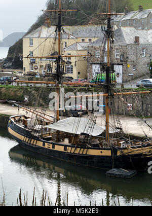 The Phoenix tall ship, wooden sailing ship moored in Charlestown Harbour, Cornwall, England. Charlestown was used as a location for filming Poldark. Stock Photo