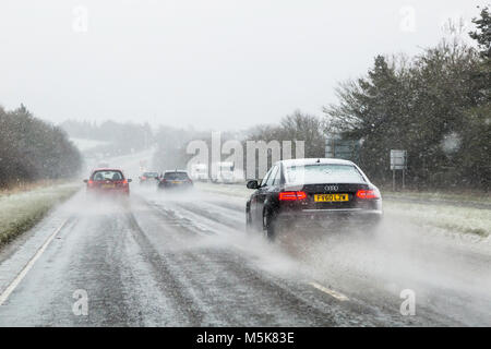 Driving in snow on a main road. Stock Photo