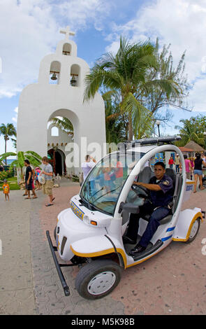 Policeman with e-car at strolling promenade of Playa del Carmen, Mexico, Caribbean