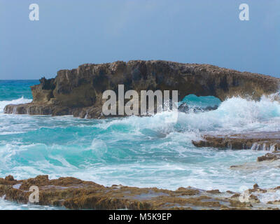 Surging billows wash around the rough rocky south east oast of Cozumel, Mexico, Caribbean Stock Photo