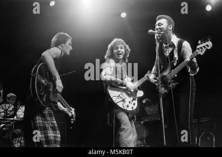 Steve Harley, George Ford, and Jo Partridge, of the British pop rock group Cockney Rebel, on stage at the Hammersmith Odeon in London in 1976. Stock Photo