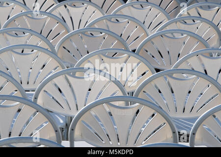 Plastic chairs put in orderly lines forming a pattern, Greensboro, North Carolina. Stock Photo