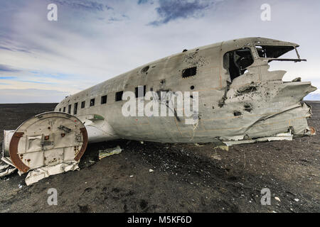 Wreckage of crashed airplane on the coast of iceland black sand beach Stock Photo