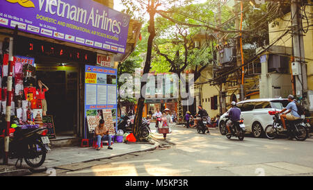 Busy streets are full of traffic and market traders in Hanoi, Vietnam Stock Photo