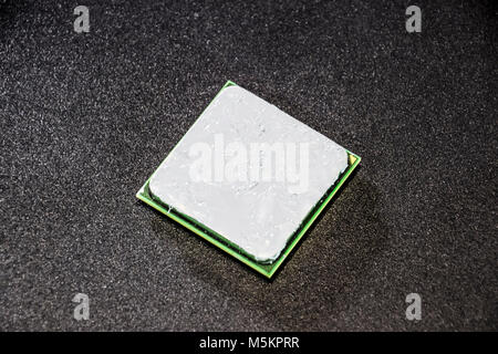 The processor of the computer with the thermal paste applied on it. Details of the computer's system unit Stock Photo
