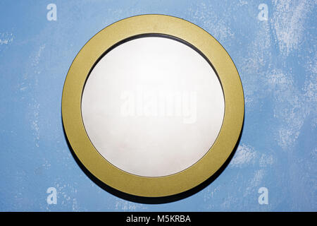 Empty plate or wall clock on blue background. Abstract photo. Stock Photo
