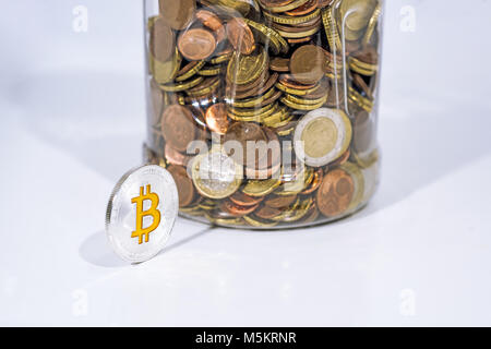 Abstract photo of cryptocyrrency. Some cryptocurrency coins in mans hand. Isolated on white background. Stock Photo