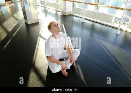 Guy doing drinking water before morning training.  Stock Photo