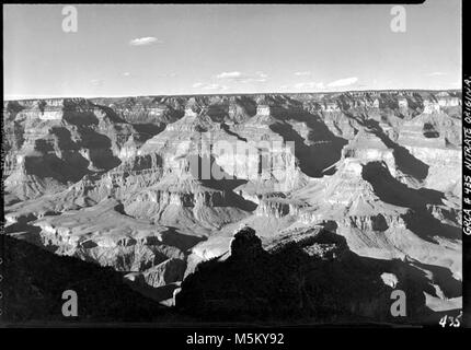 Grand Canyon HistoricScenic View from Bright Angel Lodge  . AFTERNOON SCENIC VIEW OF THE CANYON AS SEEN FROM THE BRIGHT ANGEL LODGE ON THE S RIM. BATTLESHIP FORMATION IN SHADOW. 07 OCT 1935. Stock Photo