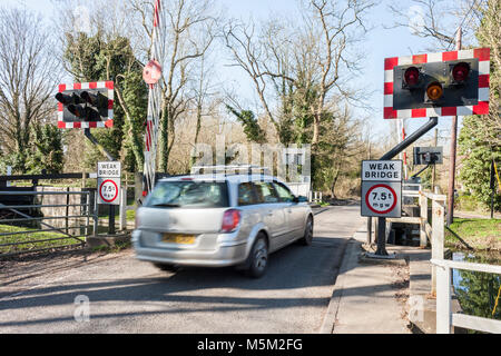 Car drives over swing bridge on the Kennet and Avon Canal at Ufton Nervet, Berkshire, England, GB, UK Stock Photo