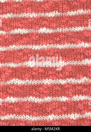 Background - closeup of knitted cotton fabric in white and orange Stock Photo
