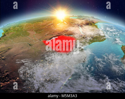 Satellite view of Zimbabwe highlighted in red on planet Earth with clouds during sunrise. 3D illustration. Elements of this image furnished by NASA. Stock Photo