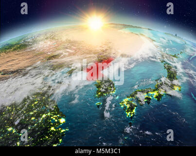 Satellite view of North Korea highlighted in red on planet Earth with clouds during sunrise. 3D illustration. Elements of this image furnished by NASA Stock Photo