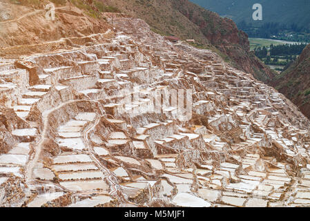 Natural salt mine in Peru. Brown pools for evaporation water from salt Stock Photo
