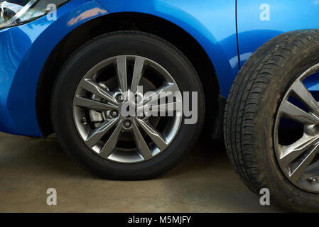Car wheel repair service. Replaced damaged car wheel Stock Photo