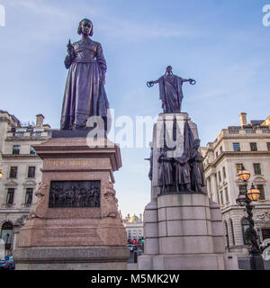 Left : Florence Nightingale with lamp statue. Right :Guards Crimean War Memorial, Waterloo Place, London. Stock Photo