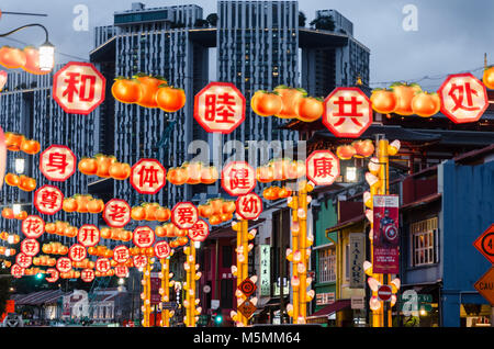 Chinatown Singapore celebrate Chinese New Year with light decoration along the road with word of blessing. Word reads Live in Harmony. Stock Photo