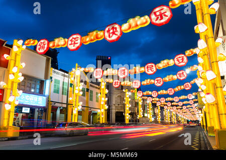 Chinatown Singapore celebrate Chinese New Year with light decoration along the road with word of blessing. Word reads Happy Chinese New Year. Stock Photo