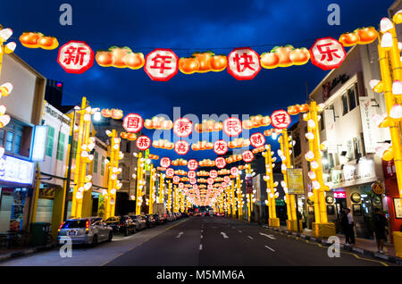 Chinatown Singapore celebrate Chinese New Year with light decoration along the road with word of blessing. Word reads Happy Chinese New Year. Stock Photo