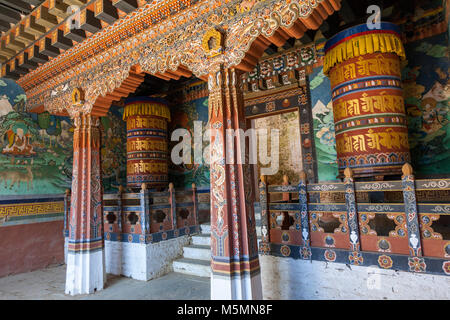 Trongsa, Bhutan.  Prayer Wheels Flank Entrance to an Inner Courtyard in The Trongsa Dzong (Monastery-Fortress). Stock Photo