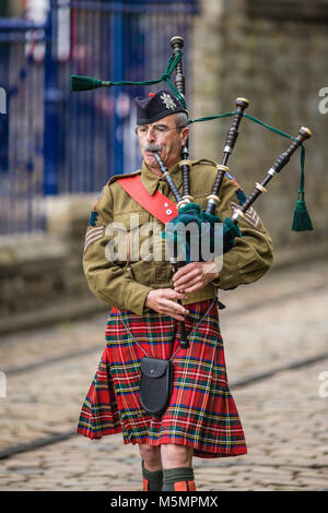 A Kilted Piper Leads the Parade at  the1940s Re-enactment Weekend at the National Tramway Museum, Crich, Derbyshire, England, UK Stock Photo