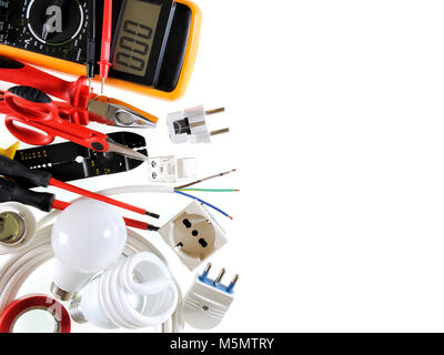 Close-up of work tools and electrical equipment on a white background with space for text / announcement. Stock Photo