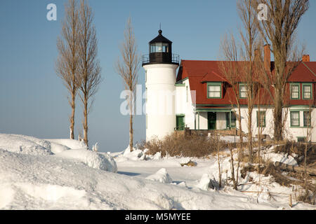 Exterior of historic Point Betsie Lighthouse on frozen Lake Michigan in winter. Stock Photo