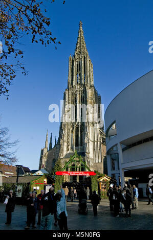 Ulm city centre, Baden Wurttemberg, Bavaria Germany during the Christmas Market, Weichnachtsmarkt, on a sunny day includesthe minster gothic cathedral Stock Photo