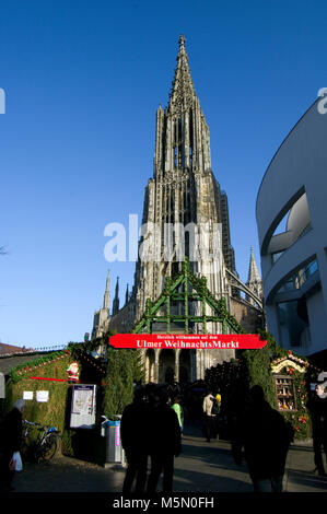 Ulm city centre, Baden Wurttemberg, Bavaria Germany during the Christmas Market, Weichnachtsmarkt, on a sunny day includesthe minster gothic cathedral Stock Photo