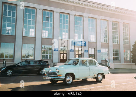 Gomel, Belarus. Old Retro Gray Volga GAZ-21 Car Moving On Lenina Street. Stock Photo