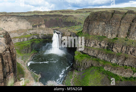 Palouse Falls is on the Palouse River about 4 miles upstream from its confluence with the Snake River in Eastern Washington.  The falls are 198 feet in height and drop into a canyon created by the Missoula flood in ancient times. Stock Photo