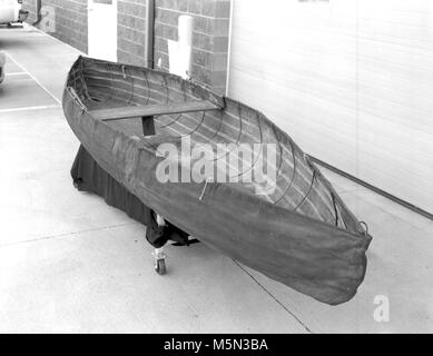 GRCA  Grand Canyon Historical Boat CollectionCollapsable Canvas Canoe . Catalog # GRCA 83613  Object CANOE  Description  COLLAPSIBLE METAL ROD FRAME CANOE COVERED WITH DARK BROWN COATED CANVAS,  SECURED TO TOP EDGES OF FRAME BY METAL RIVETS AND STAPLES. SOME OF THE METAL  RODS HAVE COME LOOSE FROM THE FRAME, AND ARE HANGING UNATTACHED. THERE ARE  ROPE RINGS AT THE BOW AND STERN. THE CANVAS IS SLIGHTLY WORN. THE BOAT IS  LABELLED, ON THE INSIDE, FRONT AND BACK, AS BEI Stock Photo