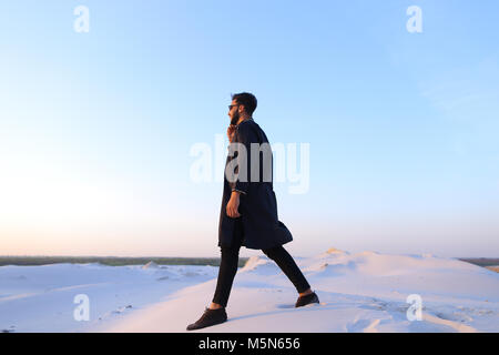 Handsome male Arab businessman talks on cellular business pro, s Stock Photo