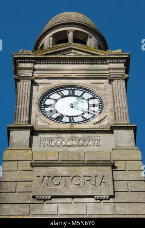 the victorian or edwardian clocktower or clock tower with a large face or dial on the guildhall in newport town centre on the isle of wight. timepiece Stock Photo