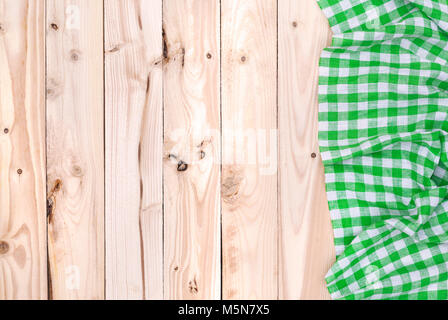 Green napkin cloth on wooden table, top view Stock Photo