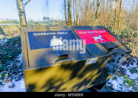 Garbage bin on trail for dog waste, Pitt Meadows, British Columbia, Canada. Stock Photo