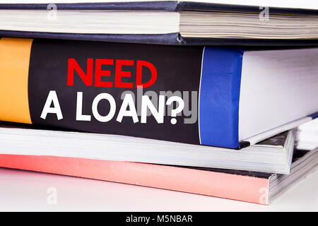 Hand writing text caption inspiration showing Need A Loan Question. Business concept for Mortage Credit written on the book the white background. Stock Photo