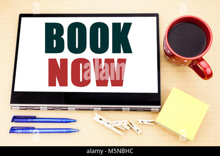Hand writing text caption inspiration showing Book Now. Business concept for Reservation Buy Booking Stock Photo