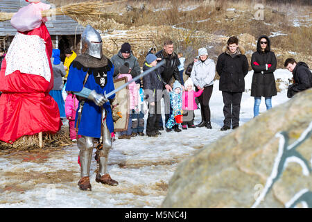 St.Petersburg, Russia - March 13, 2016: Knight's tournament at festival of Maslenitsa. Shrovetide festivities, pancake week. Celebrate end of winter.  Stock Photo