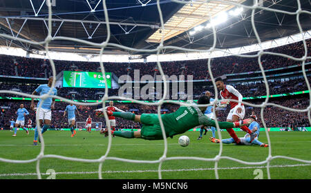 Arsenal's Pierre-Emerick Aubameyang (right) has a chance on goal during the Carabao Cup Final at Wembley Stadium, London. Stock Photo