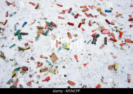 Shot gun shells strewn about on the snow Stock Photo