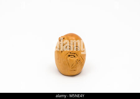 Small oriental wooden statuette Stock Photo