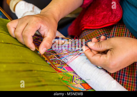 Thimphu, Bhutan.  Weaver's Hands at Work. Stock Photo