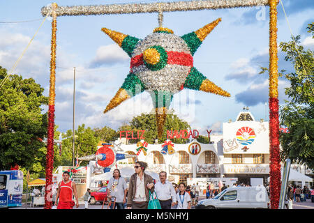 Cancun Mexico,Mexican,Avenida Tulum,Palacio Municipal,City Hall,building,Christmas Hispanic man men male,woman female women,giant piñata,local traditi Stock Photo