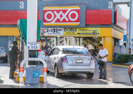 Cancun Mexico,Mexican,Avenida Tulum,Oxxo,convenience store,gasoline,petrol,gas,filling station,pump,car,Hispanic man,hose,Mex101216040 Stock Photo