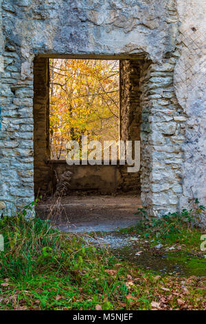 The inner room of the abandoned building of the former restaurant on the top of Mount Akhun in sunny autumn day, Sochi, Russia Stock Photo