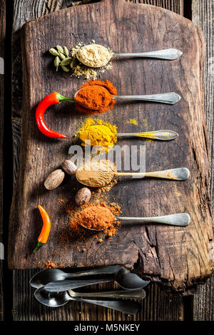 Tasty spices and herbs on old table Stock Photo