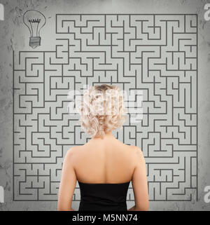 Girl on Labyrinth Background. Start up, Idea, Business Planning and Strategy Concept Stock Photo