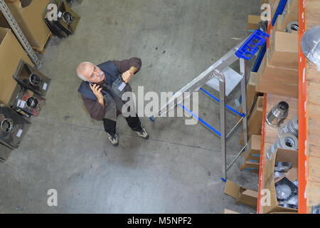 an operator works at a metal working machine Stock Photo