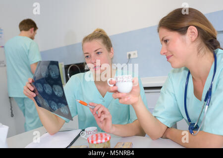 medical team chatting during coffee break Stock Photo